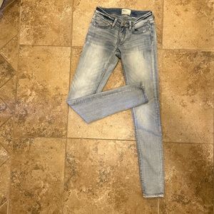 BKE Stella Skinny jeans size 25 x 31.5 light wash. Wear & tear is the original.